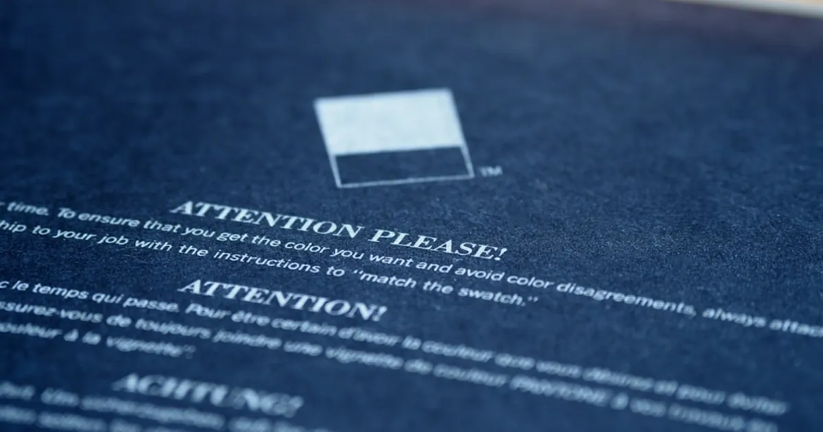 white card on blue textile